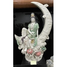 Guan yin sitting on crescent moon